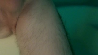 Well-hung twink jerks his uncut cock in the pool at night