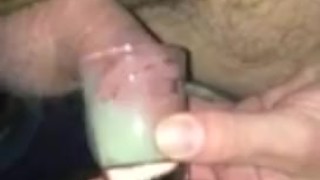 dipping my dick into a shot glass full of my own cum that I froze and thawed 2