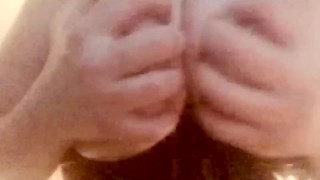 Amateur milf Playing with my wet big tits while wearing a latex corset.