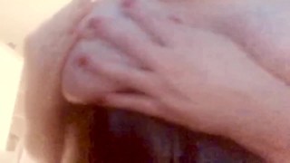 Amateur milf Playing with my wet big tits while wearing a latex corset.