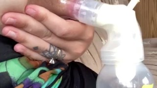 Milkymama in a bathing suit pumps milk filled tits while camping 