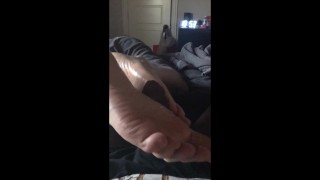 BIg soft white feet giving another black dick a footjob