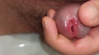 close up pissing and playing with peehole
