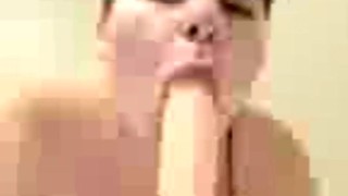 Sucking on dildo