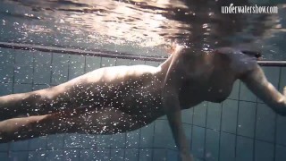 Brunette big tits teen Andrea swimming in the pool