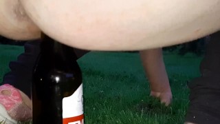 pissing and fucking a bottle in the park