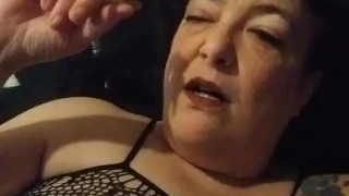 Sexy Slut Pierced Kitty in Fishnet Pantyhose Smokes in Bed