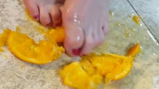 Orange crushed by virgin feet 