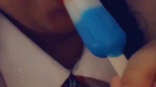 EATING A POPSICLE IN SCHOOL GIRL OUTFIT! WISH IT WAS YOUR DICK