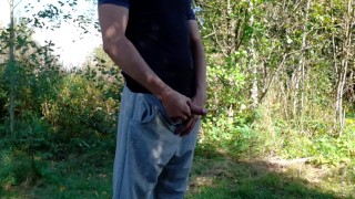 Country boy pissing in a park