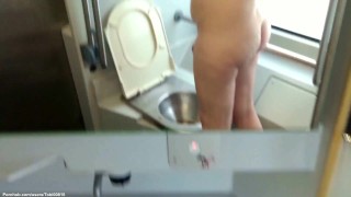 ACD01 Clip: Pissing naked in public train bathroom.