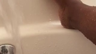 Letting the water play with my pussy while I show off my white toes