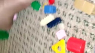 Sexy nylon feet walking on legos