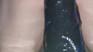 Anal training with a big black dildo