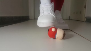 crushing little figurine