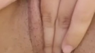 Girl touches herself in the shower with clamps on her tits