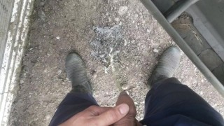 Lad taking a piss in gumboots pov