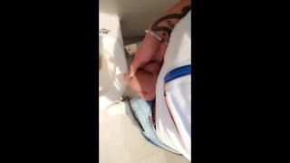 Twink with fat uncut cock piss at a rest stop toilet