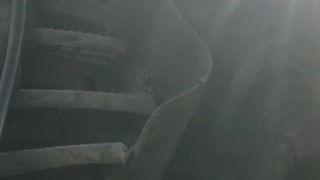 Shaved hunk in gumboots sits down and works out a hot load on tractor steps