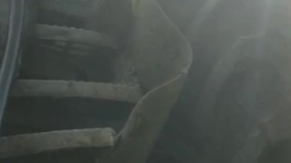Shaved hunk in gumboots sits down and works out a hot load on tractor steps