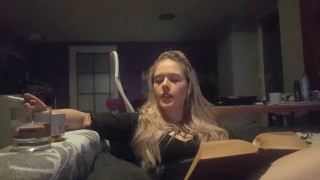 reading a book and smoking cigarette