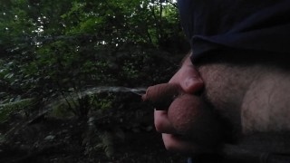 Short dick pissing in the forest