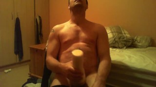 Sitting on chair watching porn fucking a felsh light till I ejaculate