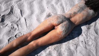 Stranger finds a perfect tanned skinny brunette on a nudist beach and gives her a hot piss 