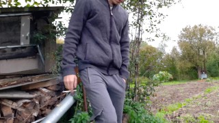 Russian guy smokes a cigarette in dirty shoes and spits