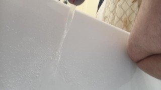Point of view from the bottom of my cock. Pissing in bathtub.