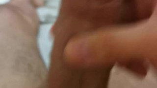 Twink masturbating in bed, close-up freshly shaved balls