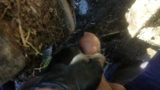 Pov lad unzips and flops it out to take a yellow piss next to muddy tire