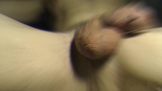 Playing with soft dick and balls while precum is dripping