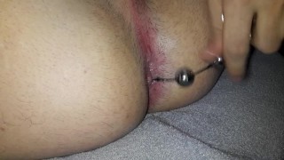 Caged slut stuffing anal beads in her ass