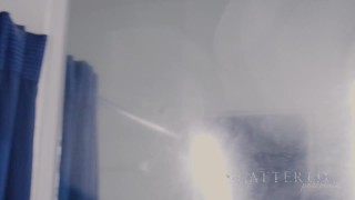 Hot brunette teases camera in shower