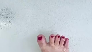 Cute toes in a bubble bath
