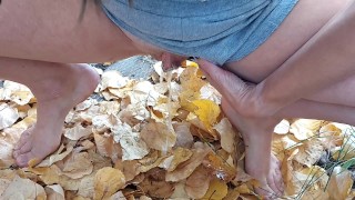 Squatting to pee in some leaves