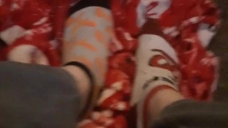 Tiny feet in mix match socks rubbing blanket