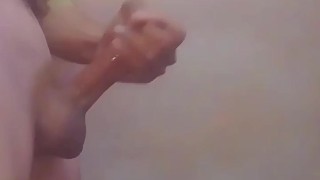 Handjob of a guy in bathroom