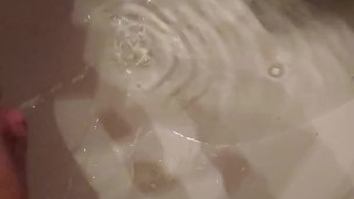 Peeing in bathroom. 