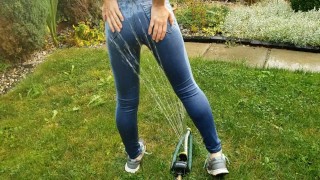Wetting My Jeans Into sockless Shoes then soaking in the sprinkler