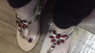 Tici feet ticii_feet IG wearing the new sandal, red nail polish