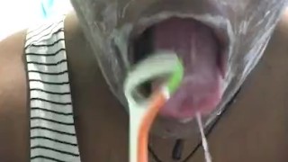 Brushing my teeth and scraping my tongue 