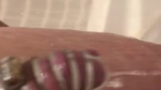 Rock hard cock caged in a shower chastity 