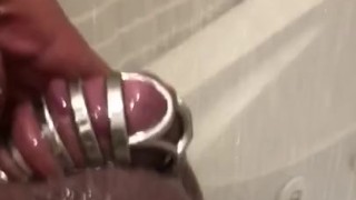 Rock hard cock caged in a shower chastity 