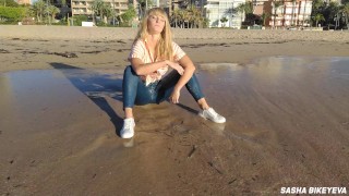 Wet shoot on a public beach with Crazy Model. Risky outdoor masturbation. Foot fetish. Pee in jeans