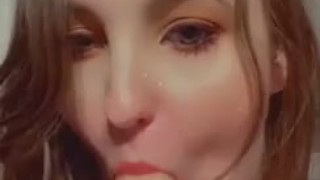  brunette with gorgeous eyes sucks off her dildo 