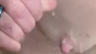 Bathtub cumshot on her tits equals easy cleanup