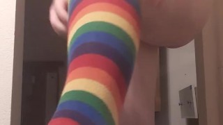 tranny tries on rainbow socks