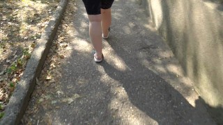 BBW in flip flops walks along the sidewalk while a voyeur peeps on her feet Public foot fetish